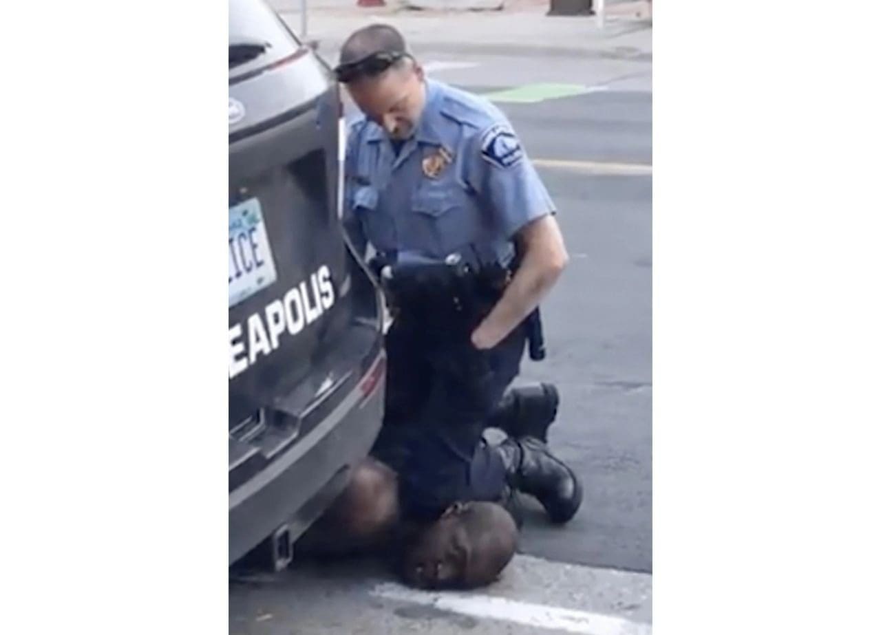 A police officer kneeling down on the ground