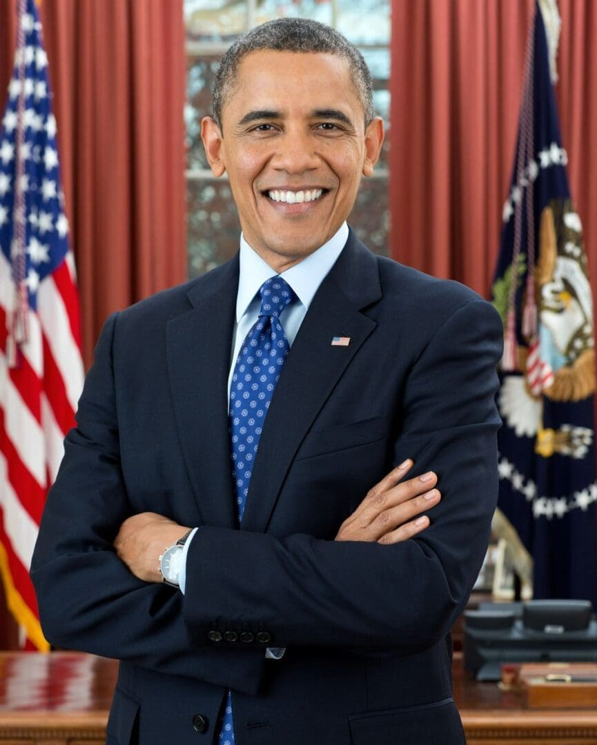 A picture of president obama in his office.