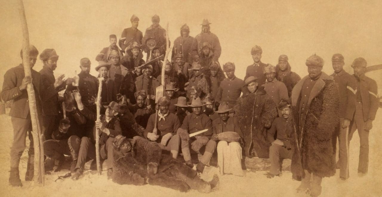 A group of men in uniform posing for a picture.